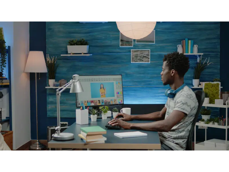 photographer retouching pictures computer with edit app