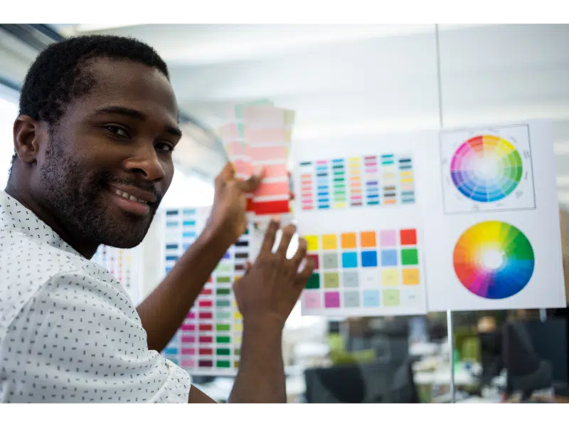 smiling worker with palettes